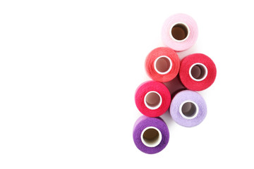 Colourful thread spools isolated on a white