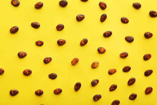 Watermelon seeds on yellow background