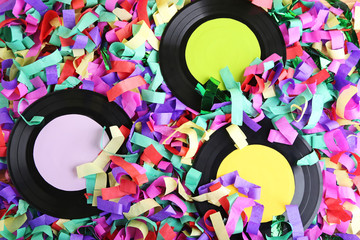 Vinyl records on colourful confetti
