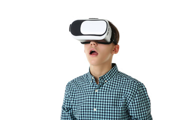 Young boy in virtual reality goggles on white background