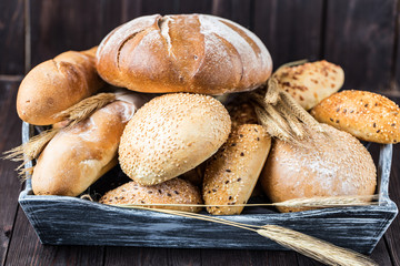 Fresh bread on table. Homemade bread. Kitchen or bakery poster design. Bread background
