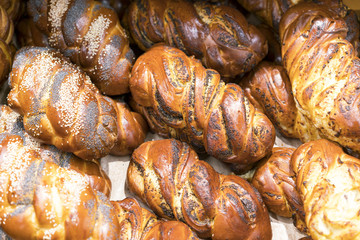 White bread with poppy seeds on the shelf in the store