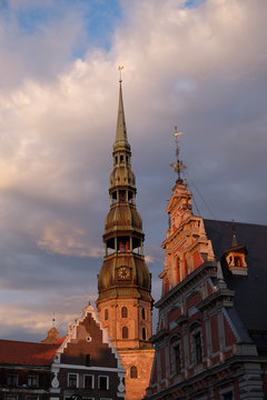 Ancient Saint Peter church and old tower in Riga at sunset