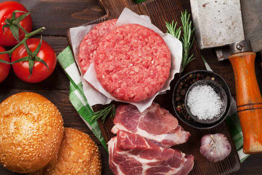 Raw minced beef meat and ingredients for burgers