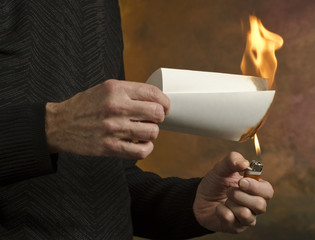man burning document