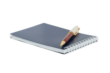 Beautiful ballpoint pen on closed notebook. isolated