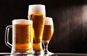 Keuken spatwand met foto Composition with three glasses of lager beer © monticellllo