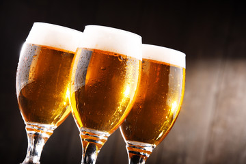 Composition with three glasses of lager beer