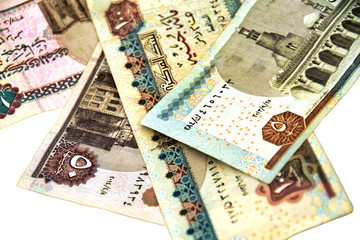 Paper money. Banknotes of Egyptian pounds on white background. Isolated. Selective focus.