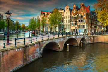 Fototapeta premium Fantastic water canals with bridges and colorful houses, Amsterdam, Netherlands