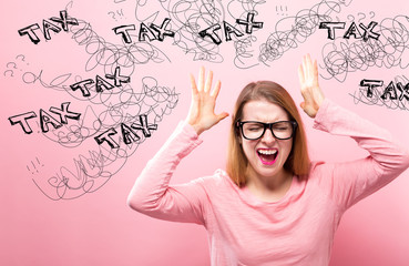 Tax with young woman feeling stressed on a pink background