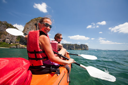Women are kayaking in the open sea at the Krabi shore, Thailand