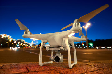 Drone ready to fly standing on urban street