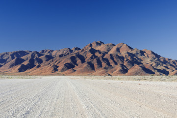 Road in the Namib desert in the morning / Road in the Namib desert in the morning, Namibia, Africa.