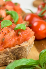 Slices of toasted baguette with tomato - bruschetta - close up