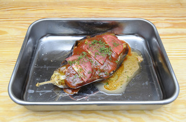 Crimean Tatar dish Imam Bajldy – braised eggplant, stuffed with mutton and seasoned with parsley, red pepper and tomato sauce