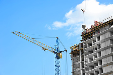 Crane and highrise construction site