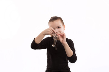 cheerful little girl holding the keys