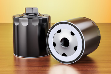 Car oil filters on the wooden table. 3D rendering