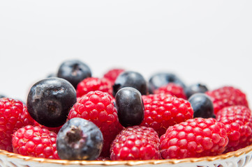 fresh blueberry and rasberry on white background