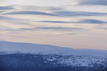 Lenticular clouds. Northern Ural mountains landscape, Russia .