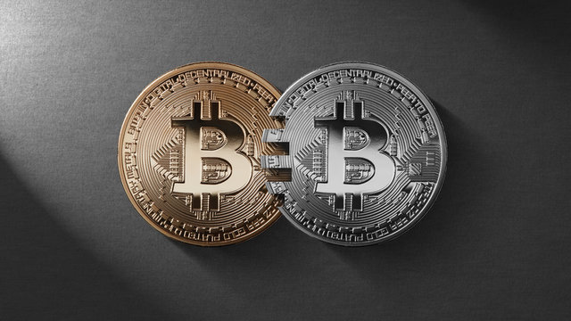 Two coins bitcoin on a black background money transfer concept.