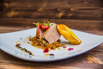 Food on a plate, on a wooden background.Food detail