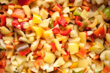 cut slices pieces of red, yellow and green sweet bell pepper macro closeup