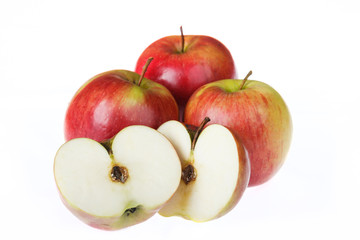 Naklejka na ściany i meble Four apples on a white background. One cut in half.