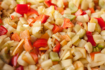 cut slices pieces of red, yellow and green sweet bell pepper macro closeup