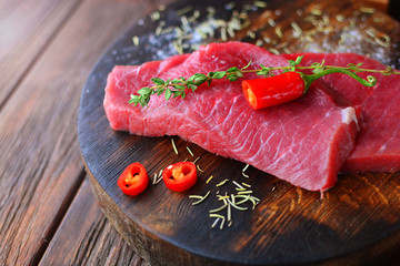 Macro of a steak meat beef on a rural wooden desk.
