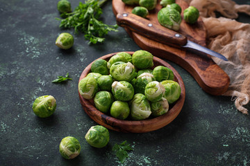 Brussels sprouts on green concrete background