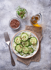 Healthy spring salad with cucumber, flax seed and cress 