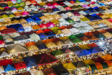 Fototapeta na wymiar Multicolour Rod Fai night Market located in Ratchada area of Bangkok, Thailand