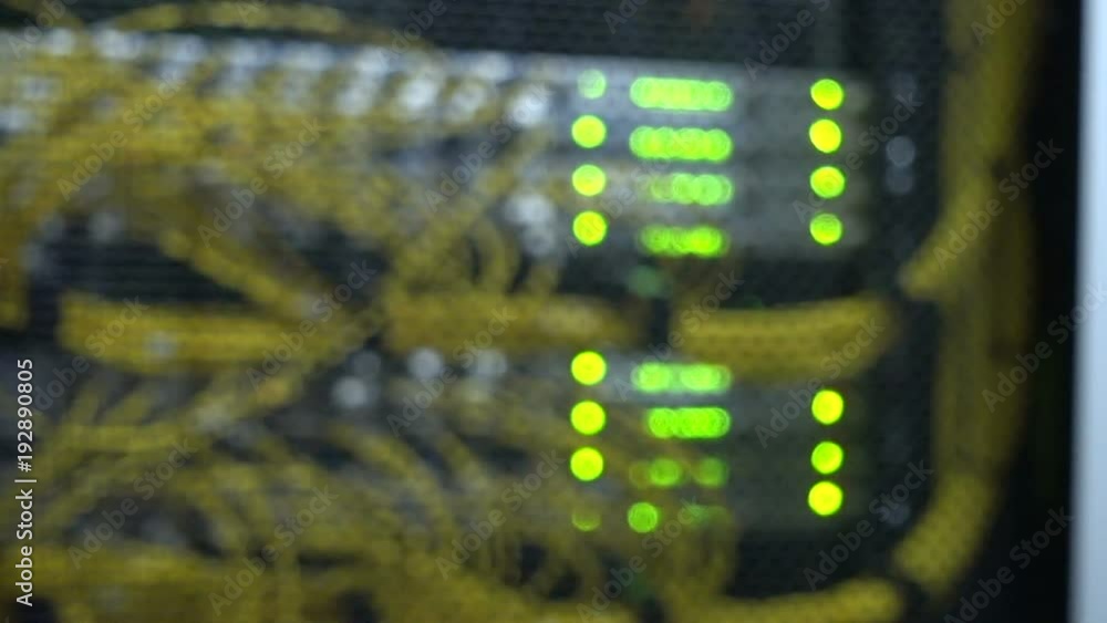 Poster rack mounted servers in a server room, server rack audio cable. severs computer in a rack at the lar