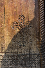 A fragment of an old wooden door in the monastery