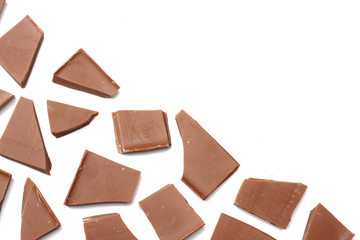 cracked chocolate candies sweets isolated on white background top view