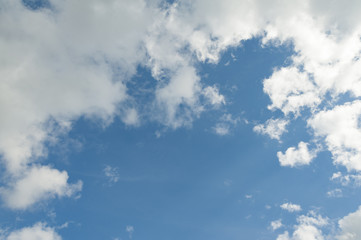 Obraz premium The light blue sky with white clouds for background or texture. Copy space