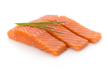 Fresh salmon fillet with basil on the white background.
