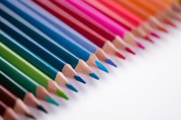 colour pencils on white background back to school concept