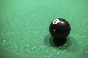 black billiard ball on the table, number 8