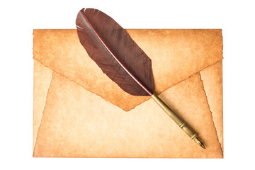 Old vintage burned envelope letter with quill feather pen isolated on a white background