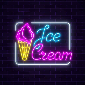 Glowing neon ice cream cafe signboard on dark brick wall background. Fruit ice-cream in waffle cone.