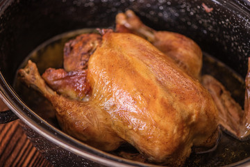roast chicken out of oven in roasting  pan 