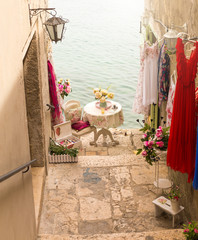 A view of the charming narrow stone streets of the medieval town of Rovinj, Khovatia. Resting place, romantic vintage decor.