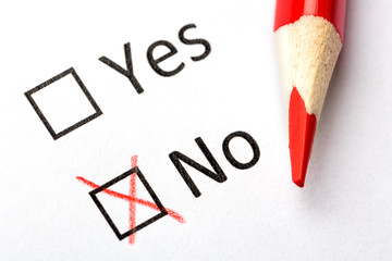 Questionnaire concept. Yes or No checkboxes with red pencil. Close up image