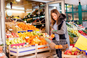 Woman buying fresh fruits