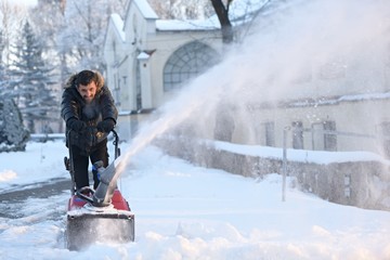 snow blowing man