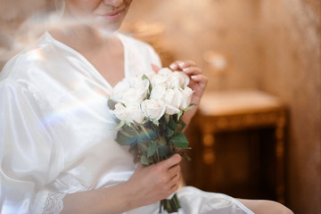 Obraz na płótnie Canvas Close up macro shot of bride holding beautiful tender wedding bouqet of wonderful flowers in her hands