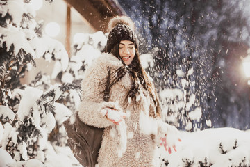 Woman walking in winter evening.